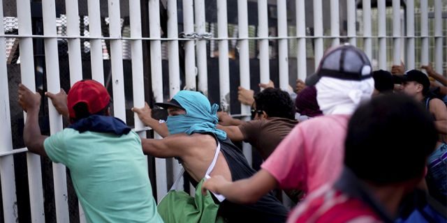 Central American migrants customs gate Tecun Uman.