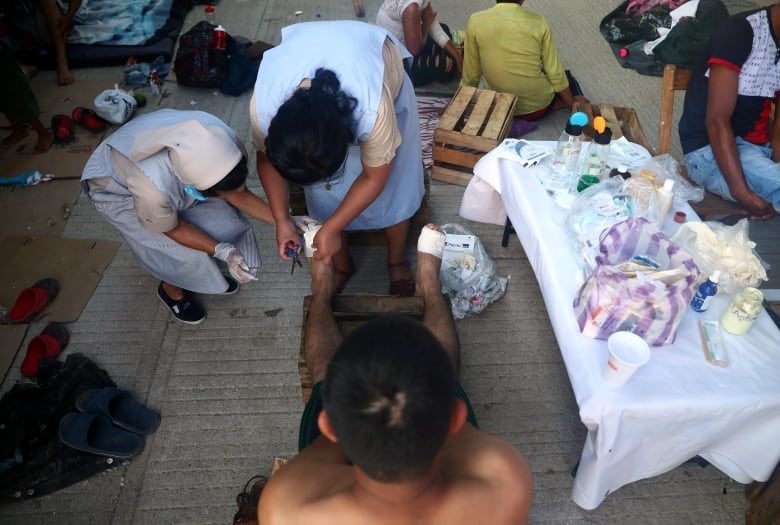 Click to enlarge Central America migrant caravan