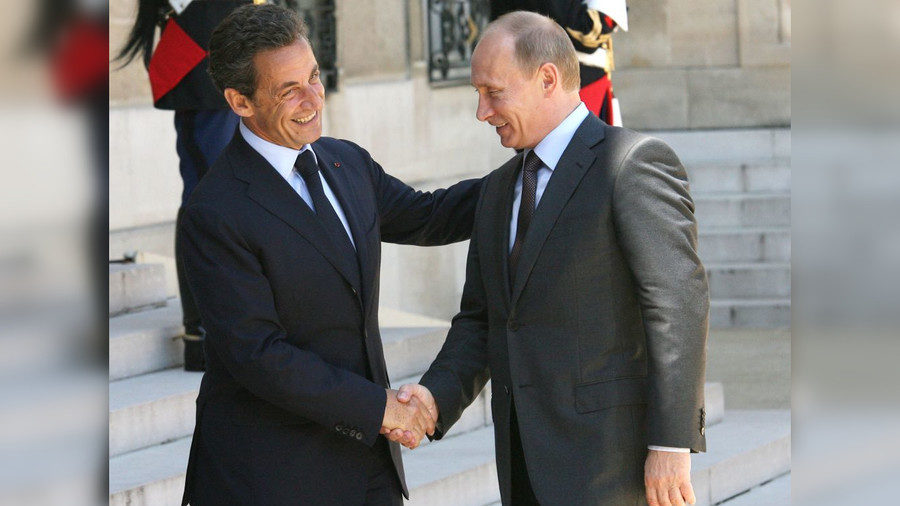Then French President Nicolas Sarkozy (L) meets Vladimir Putin at the Elysee Palace in Paris in 2010.