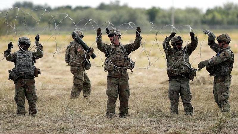 troops razor wire mexican border