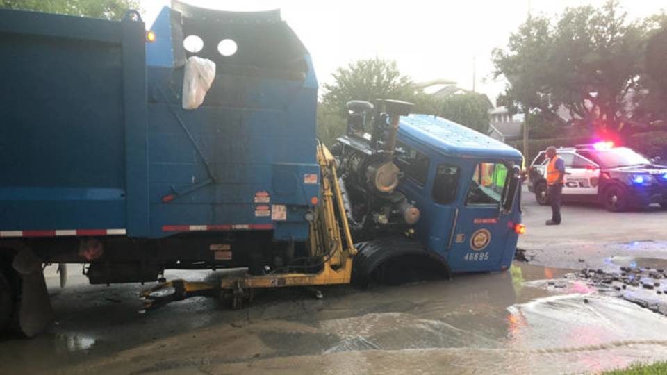 A truck is seen after it fell into a sinkhole in Montrose on Nov. 5, 2018.