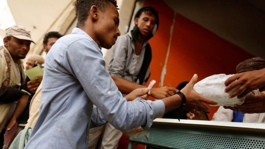 man receives food ration Yemen