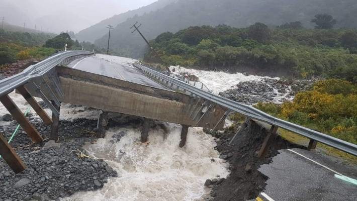The Goat Creek bridge on SH73 has been washed out in the deluge.