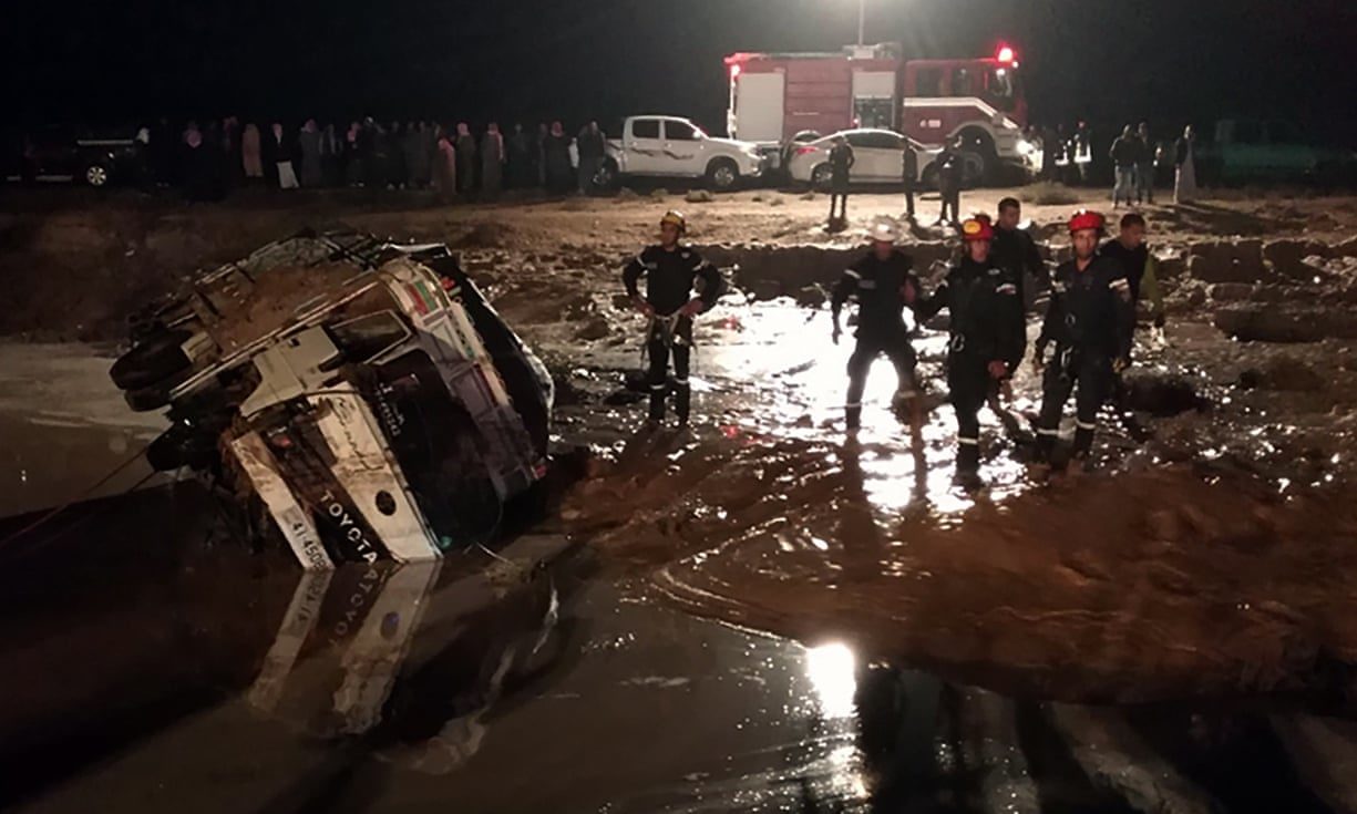Jordanian civil protection services work on a road damaged by flash floods, near Madaba, some 30 kilometres south of Amman. Photograph: Petra News Agency Handout/EPA