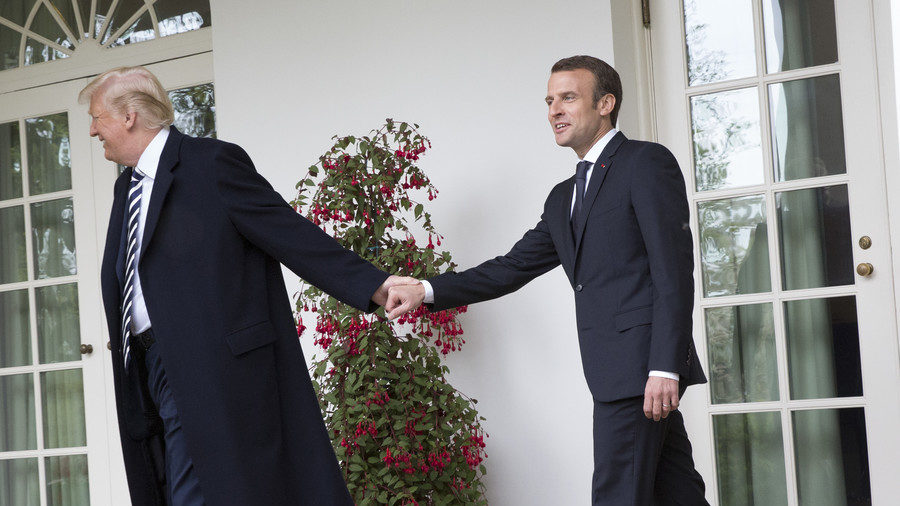 Trump and Macron holding hands
