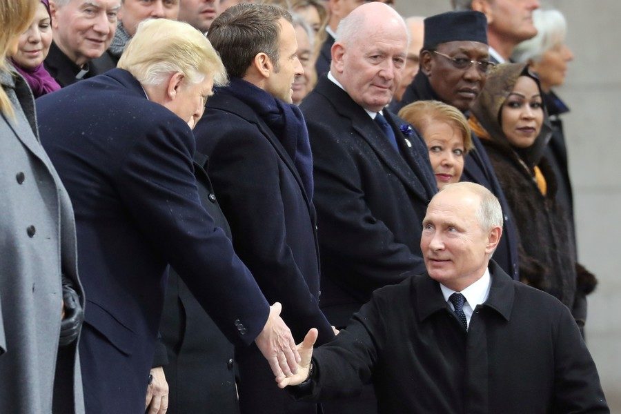 Russian President Vladimir Putin shakes hands with U.S. President Donald Trump as he arrives to attend a commemoration ceremony for Armistice Day in Paris, France, November 11, 2018
