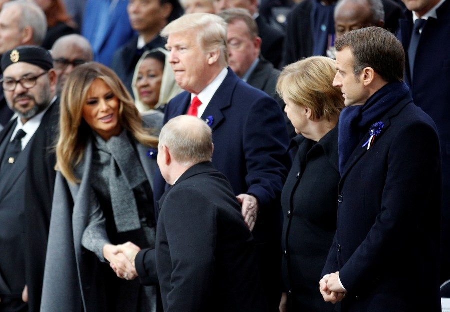 U.S. President Donald Trump and first lady Melania Trump greet Russian President Vladimir Putin during a commemoration ceremony for Armistice Day in Paris, France, November 11, 2018