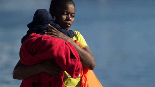 Click to enlarge migrant woman child