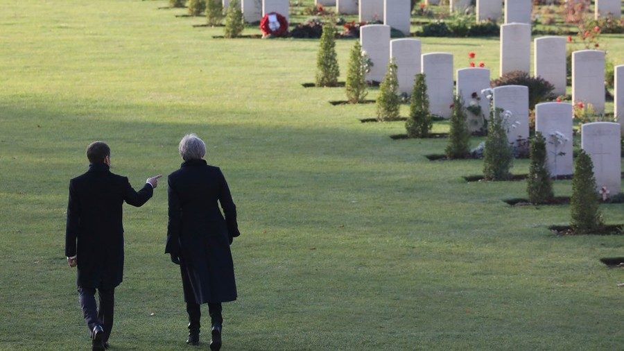 Click to enlarge Theresa May and Emmanuel Macron