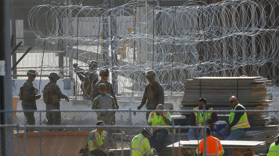 US troops razor wire fence barricade Mexico migrant caravan