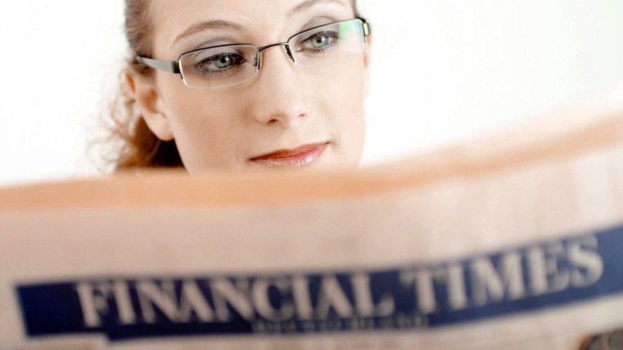 woman reading paper