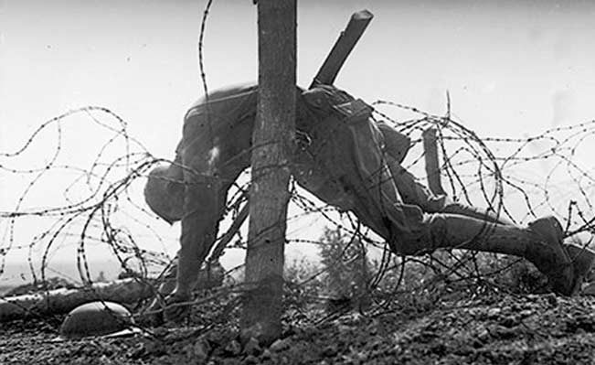 Click to enlarge WW1 American soldier barbed wire