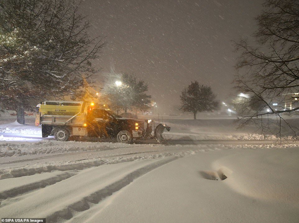 Click to enlarge A plow clears a parking lot at the Hudson Valley Towne Center parking lot in Fishkill