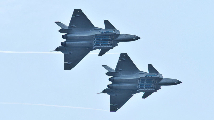 Chengdu J-20 stealth fighter jets with open weapon bays during the Zhuhai Airshow