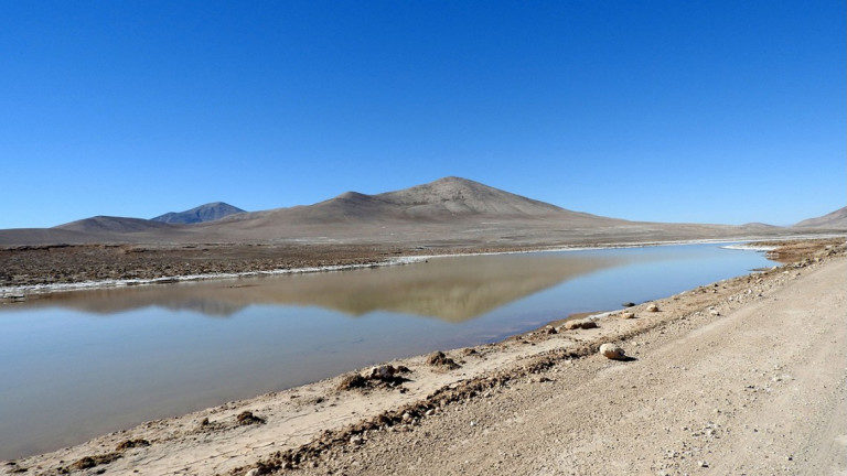Click to enlarge A small, temporary lagoon in the Atacama Desert caused by unprecedented rains.
