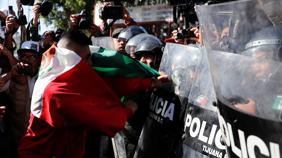 police migrant caravan riot protesters