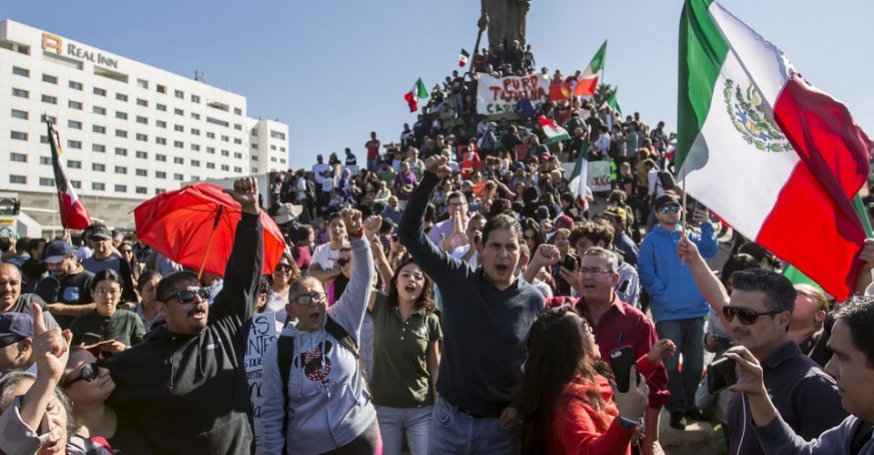 Click to enlarge protest migrants migration Mexico Tijuana