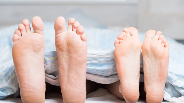 Click to enlarge Feet in bed