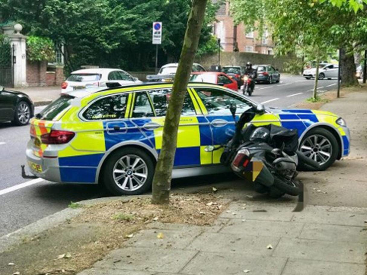 Click to enlarge cop car and moped