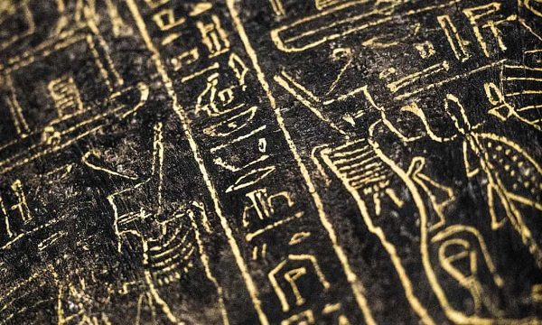 Hieroglyphs carved on a black wooden sarcophagus