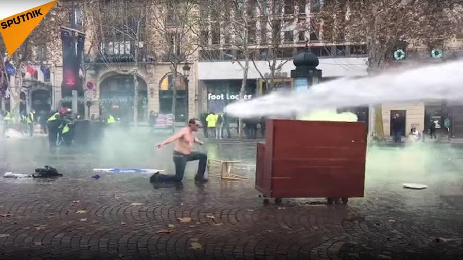 shirtless man yellow jacket protest paris