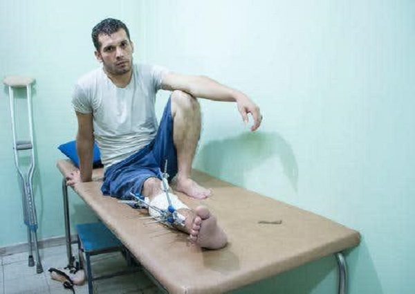 Click to enlarge Gaza protester with bullet wound