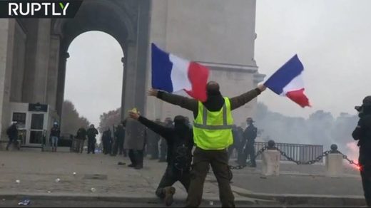 yellow vest protester french flag