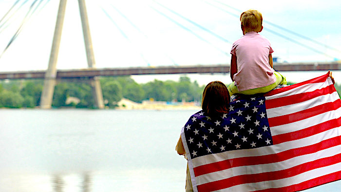 woman boy flag