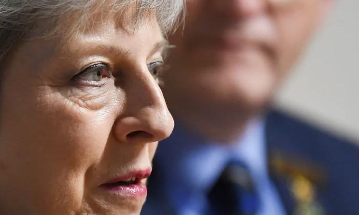 Click to enlarge Theresa May
