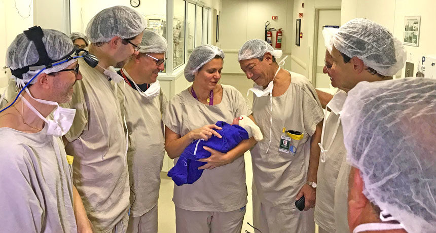 Click to enlarge staff with baby