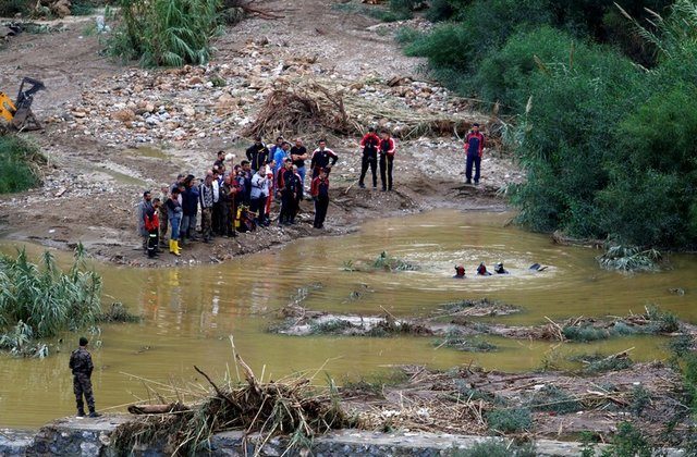 Divers search a swollen river in Kyrenia