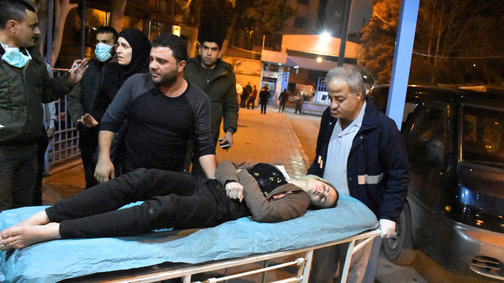 A woman lies on a stretcher after a toxic gas attack in Aleppo, Syria November 24, 2018. Picture taken November 24, 2018