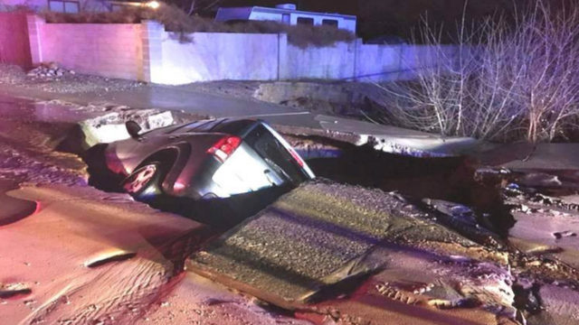 A sinkhole swallows an SUV