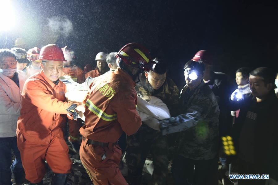Rescuers work at the site of landslide in Fenshui Town of Xuyong County, southwest China's Sichuan Province, Dec. 9, 2018.