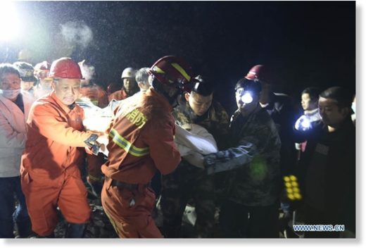 Rescuers work at the site of landslide in Fenshui Town of Xuyong County, southwest China's Sichuan Province, Dec. 9, 2018.