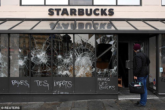 starbucks window paris yellow vest protest