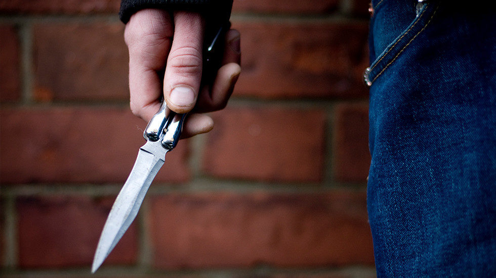 teen holding knife