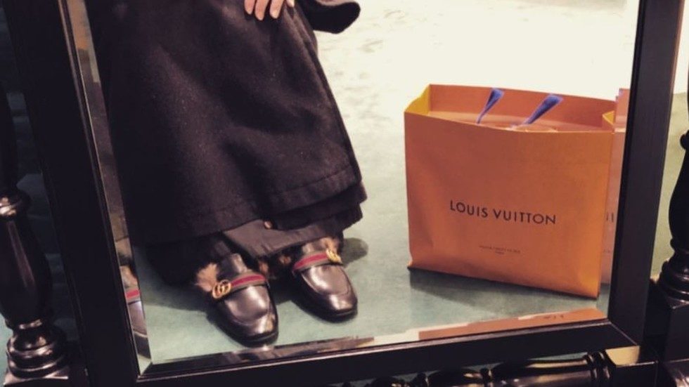Click to enlarge Cleric wears Gucci shoes