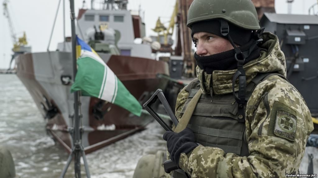 A Ukrainian serviceman stands on board a Coast Guard ship in the Sea of Azov.