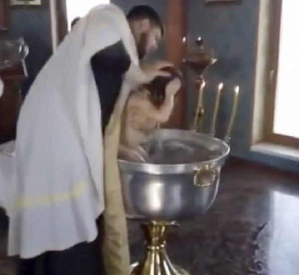 Click to enlarge Russian priest's violent baptism