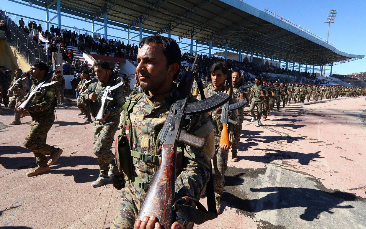 The US-backed SDF fighters are marching at a military parade in Syria.