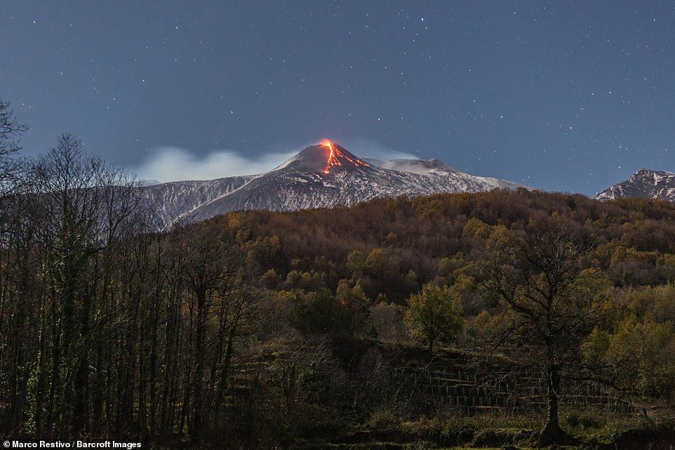 Lava could be seen trickling down the side of the volcano from miles away, as it continued to spew the molten liquid throughout the early hours of this morning.