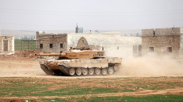 A Turkish tank drives east of al-Bab, Syria