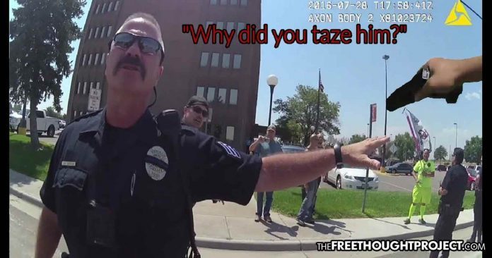 Click to enlarge cop stops man tazers