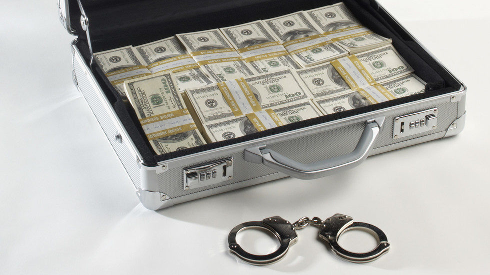 briefcase money handcuffs embezzle3ment