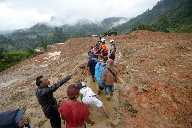 rescue workers search for survivors at the site