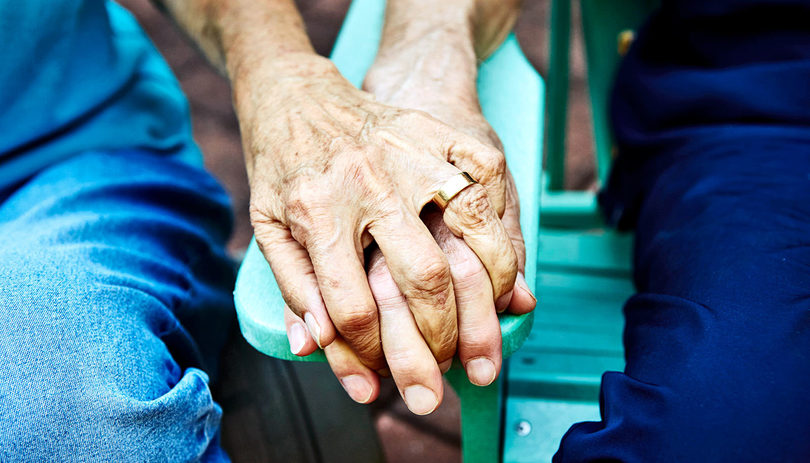 old couple holding hands