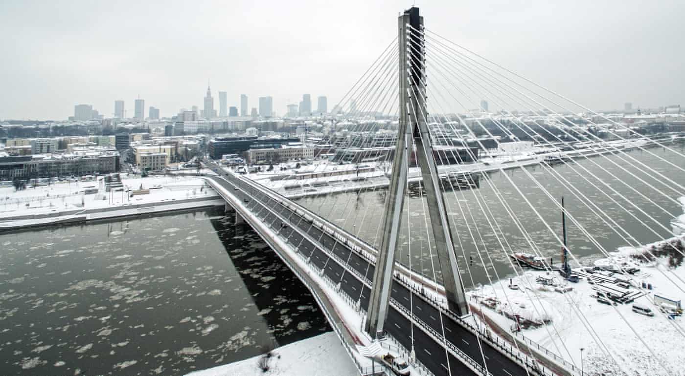 Click to enlarge Aerial picture taken by a drone shows a snowy panorama of Warsaw and the Vistula River with Swietokrzyski Bridge in Poland