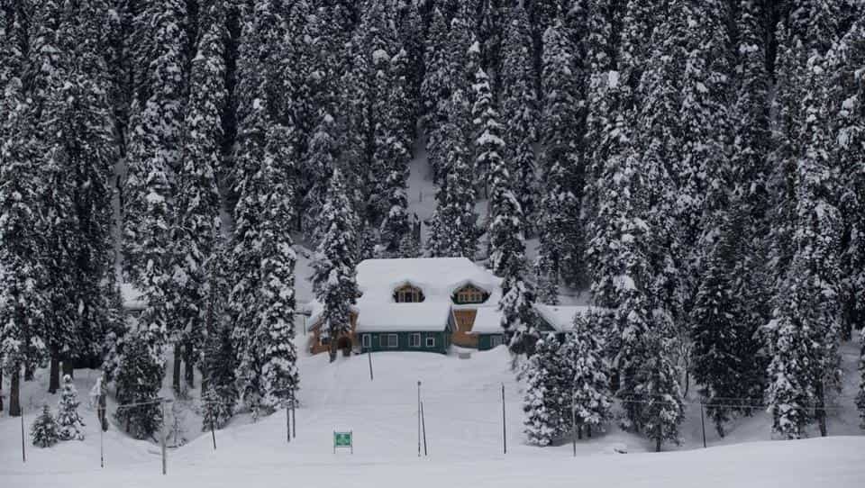 A view of a snow covered hut in Gulmarg, 55 kilometers north of Srinagar,