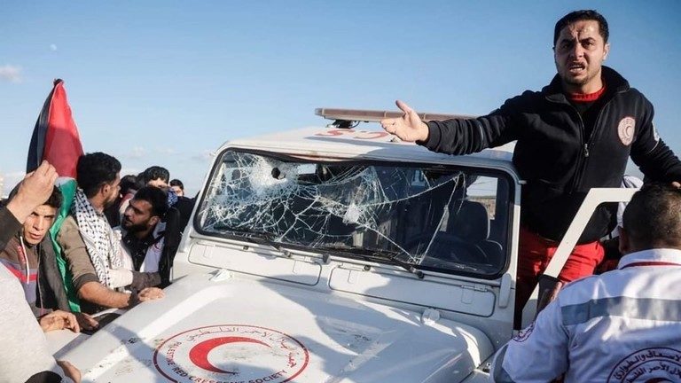 ambulance hit by a tear gas canister,